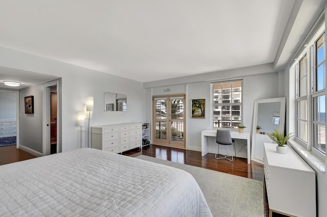 bedroom featuring dark hardwood / wood-style floors and access to outside