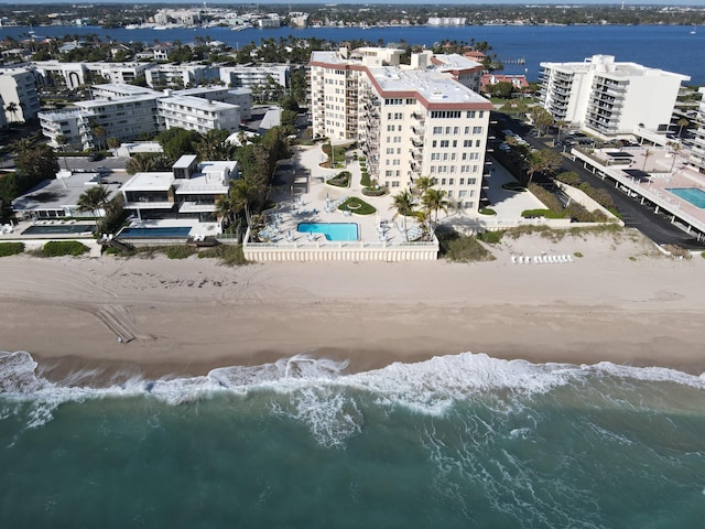 bird's eye view with a view of the beach and a water view