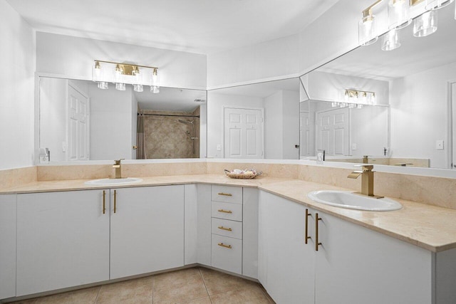 full bathroom featuring tile patterned flooring and vanity