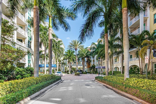 view of road featuring a residential view and curbs