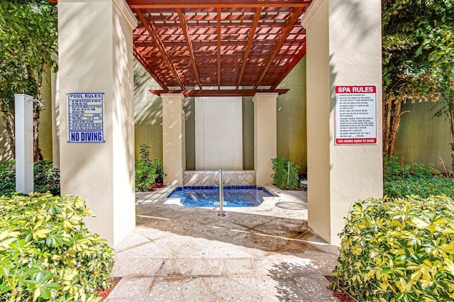 view of swimming pool featuring a pergola