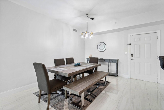 dining space with baseboards, visible vents, and an inviting chandelier