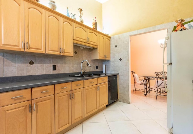 kitchen with dishwasher, backsplash, sink, light tile patterned floors, and white fridge