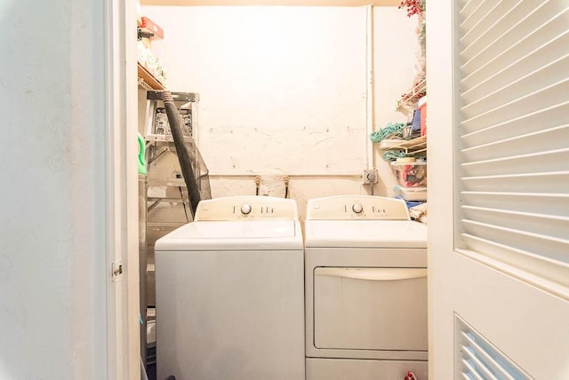 laundry room with independent washer and dryer