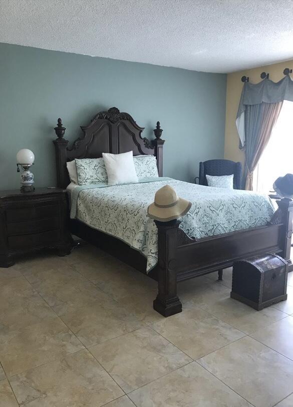 bedroom featuring a textured ceiling