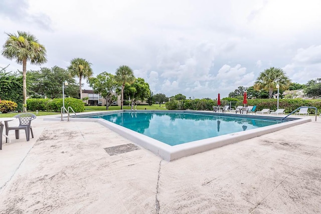 view of pool featuring a patio area