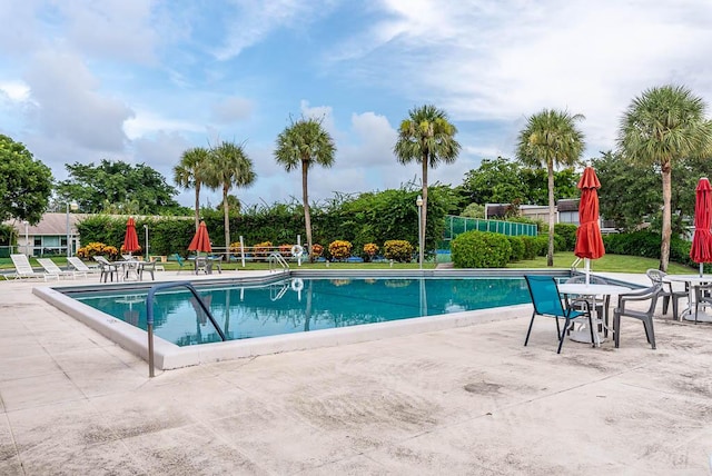 view of swimming pool featuring a patio area