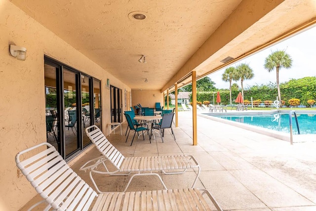 view of patio / terrace featuring a community pool