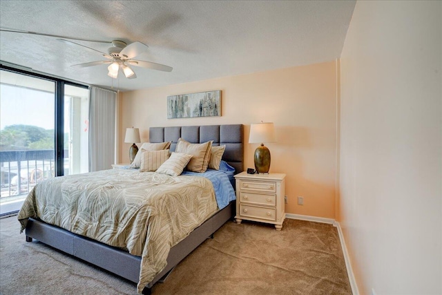 carpeted bedroom featuring ceiling fan, floor to ceiling windows, access to exterior, and a textured ceiling