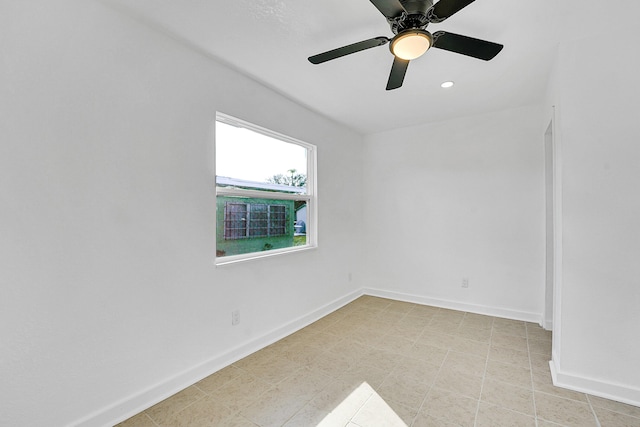 spare room featuring ceiling fan