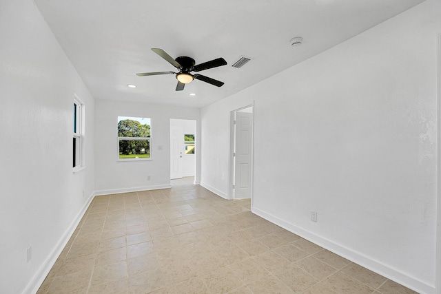 spare room with ceiling fan