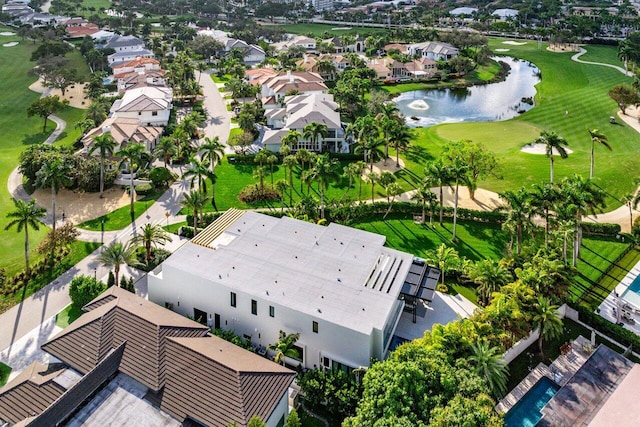 birds eye view of property featuring a water view and a residential view