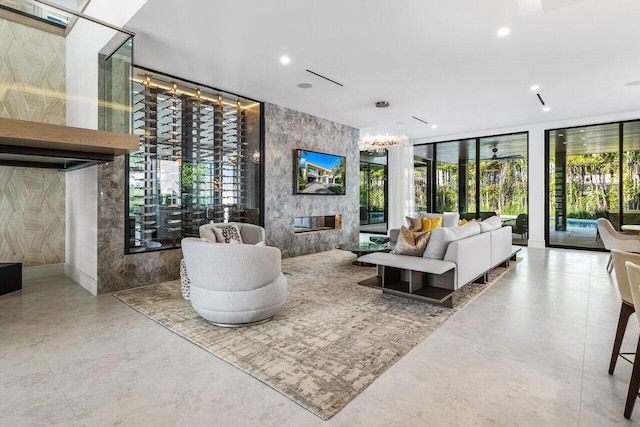 living room with a fireplace, floor to ceiling windows, and recessed lighting