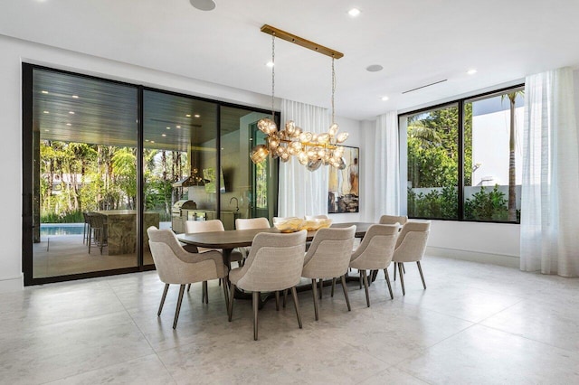 dining room featuring an inviting chandelier and recessed lighting