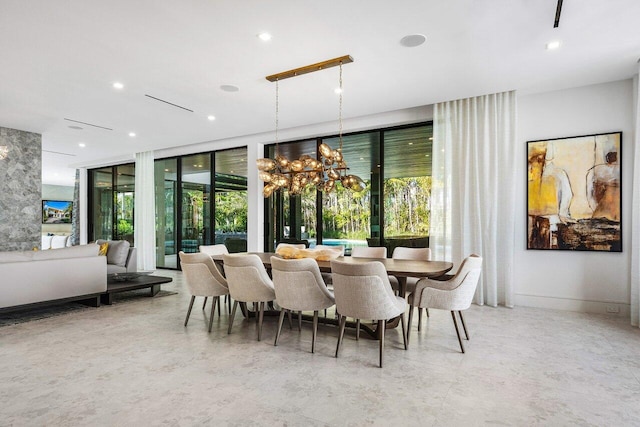 dining space with recessed lighting, a notable chandelier, and baseboards