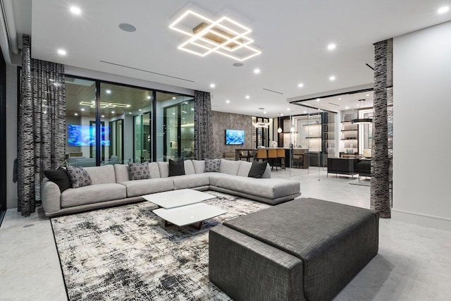 living area with concrete flooring and recessed lighting