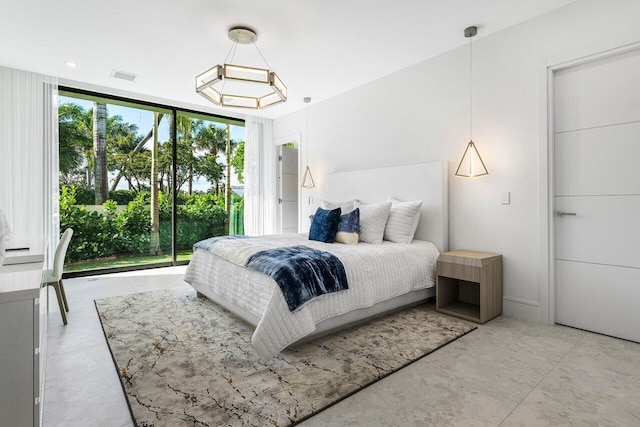 bedroom with expansive windows and visible vents