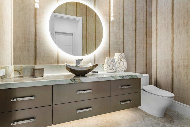 bathroom featuring vanity, toilet, and tile patterned floors