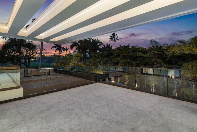 view of patio terrace at dusk