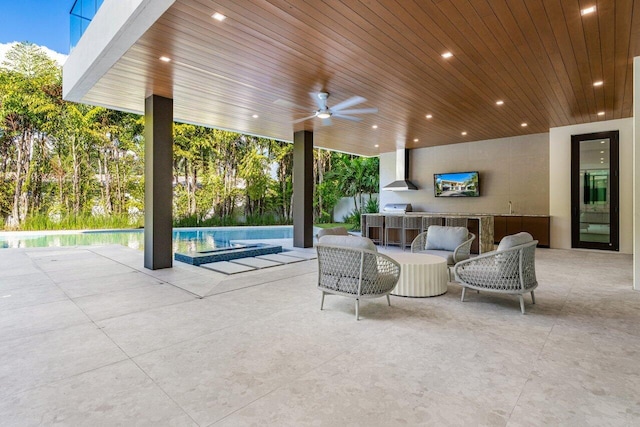 view of patio with area for grilling, a grill, ceiling fan, outdoor wet bar, and an outdoor pool