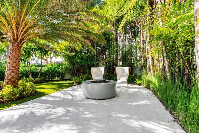 view of patio / terrace with an outdoor fire pit