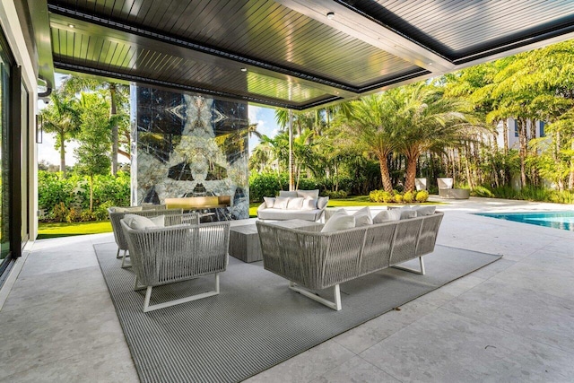 view of patio / terrace featuring an outdoor pool and an outdoor hangout area