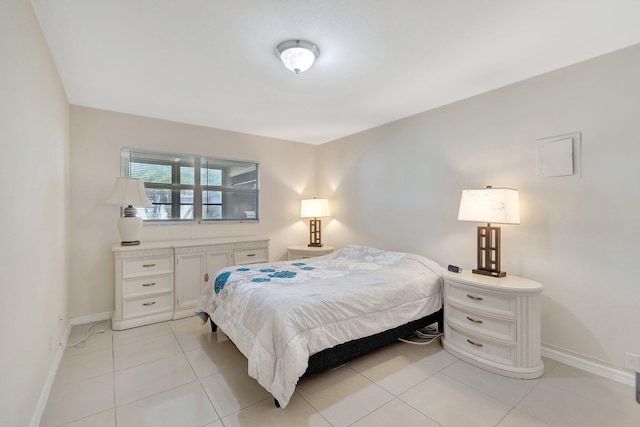 bedroom featuring light tile patterned floors