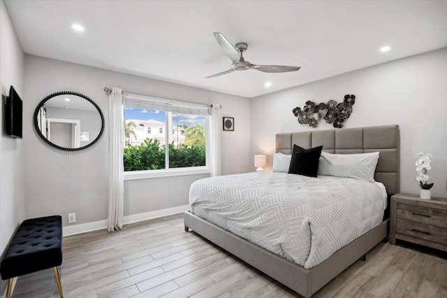 bedroom featuring ceiling fan and light hardwood / wood-style flooring