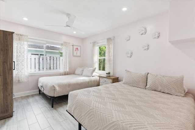 bedroom featuring ceiling fan and light hardwood / wood-style floors