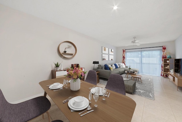 dining room with ceiling fan and light tile patterned flooring