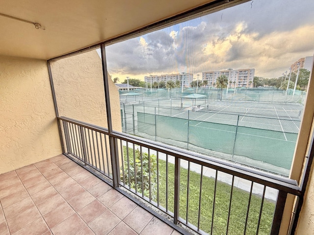 view of balcony at dusk