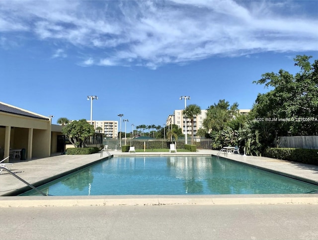 view of swimming pool with a patio area