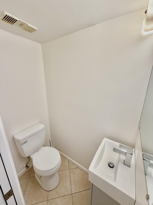 bathroom with tile patterned flooring and toilet