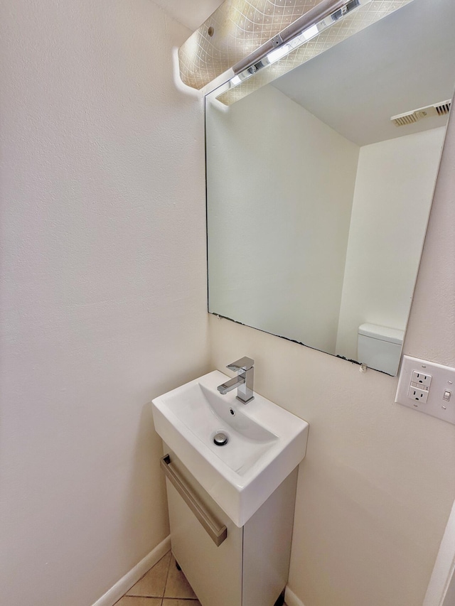 bathroom with tile patterned flooring and vanity