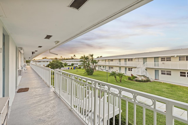 view of balcony at dusk