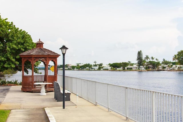 view of patio / terrace with a gazebo and a water view