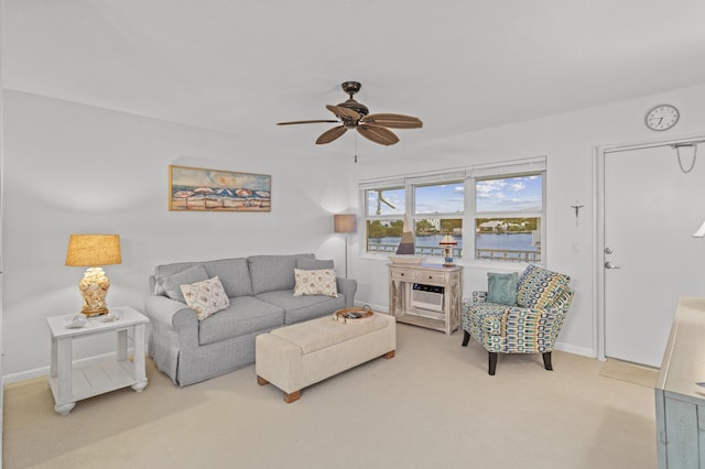 living room featuring light colored carpet and ceiling fan