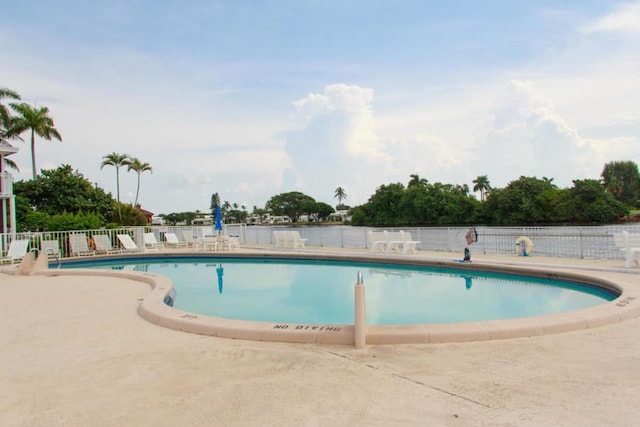 view of swimming pool with a patio