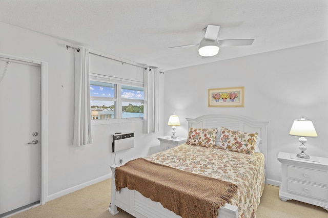 bedroom featuring light colored carpet and ceiling fan