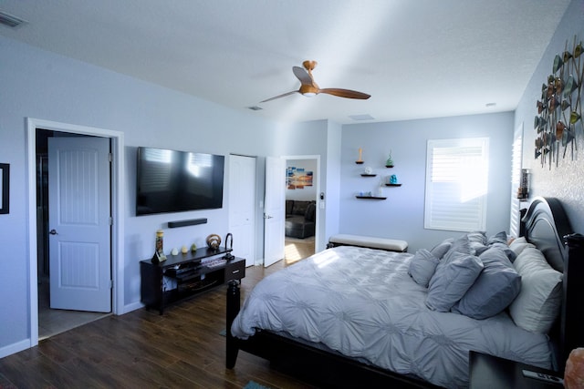 bedroom featuring dark hardwood / wood-style floors and ceiling fan