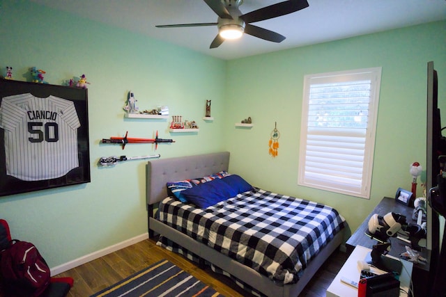 bedroom featuring ceiling fan and dark hardwood / wood-style flooring