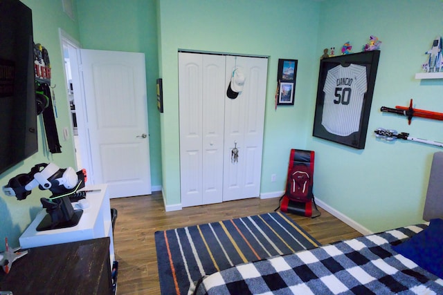 bedroom featuring a closet and dark wood-type flooring