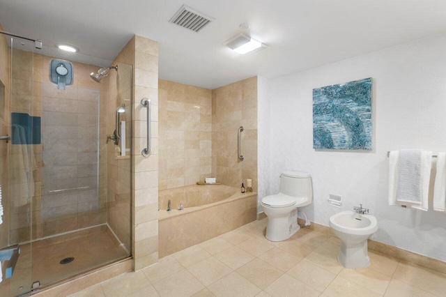 bathroom featuring toilet, a bidet, and independent shower and bath