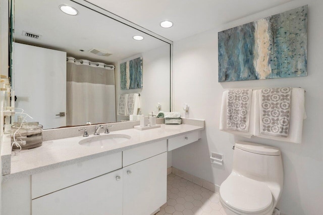 bathroom with curtained shower, tile patterned flooring, vanity, and toilet