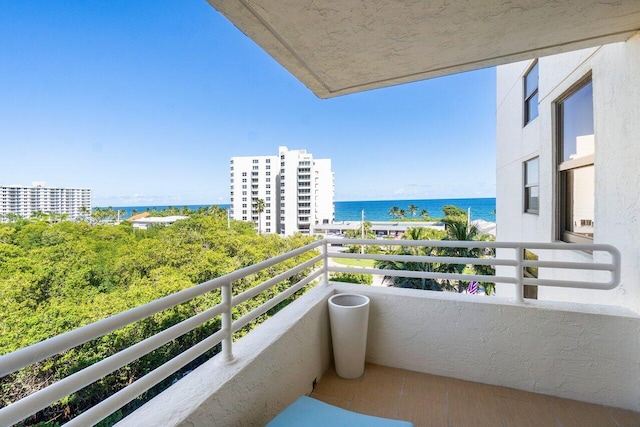 balcony featuring a water view