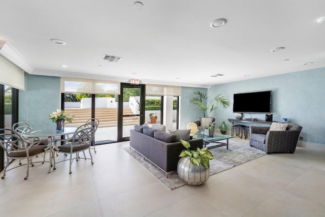 living room with floor to ceiling windows and crown molding