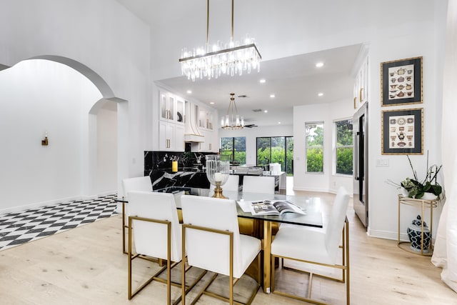 dining space with light hardwood / wood-style floors