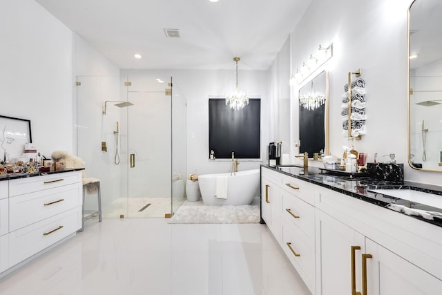 bathroom featuring a chandelier, tile patterned floors, vanity, and separate shower and tub