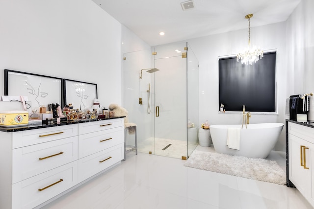 bathroom featuring a notable chandelier, vanity, and plus walk in shower