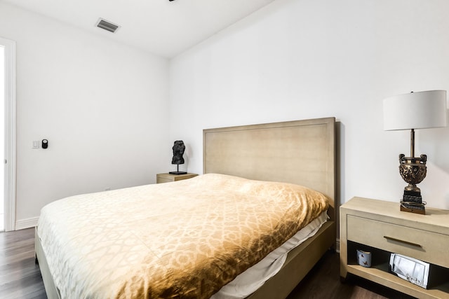 bedroom featuring dark wood-type flooring